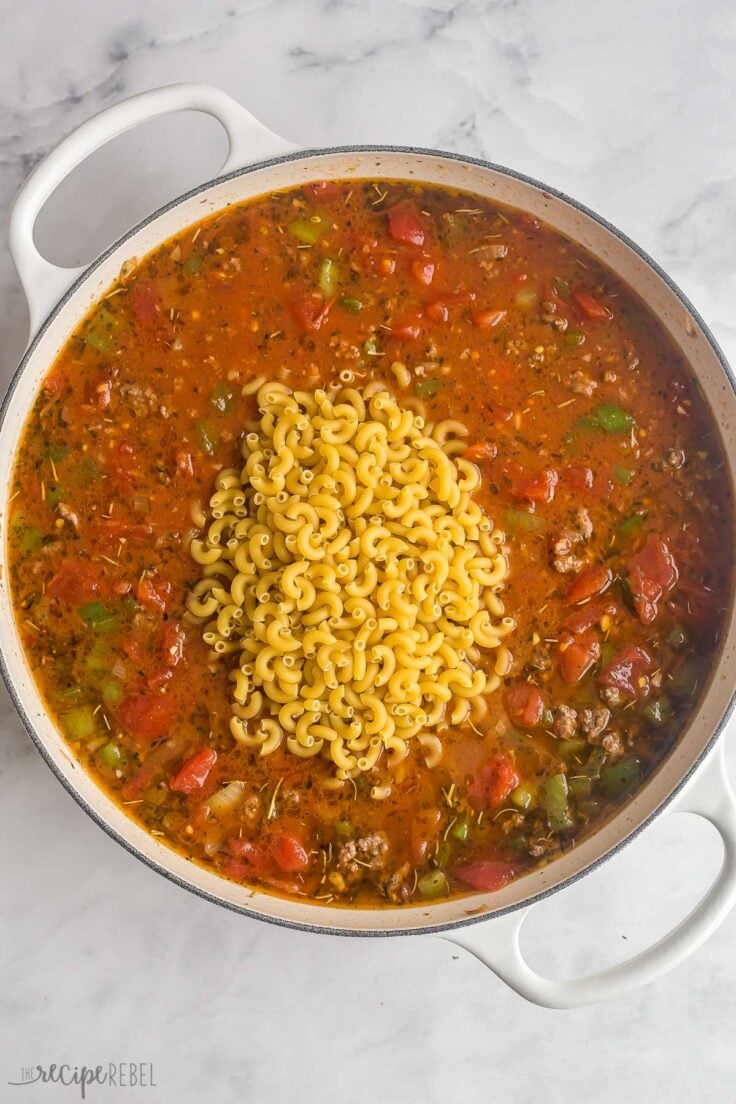 dry macaroni added to pan to make goulash