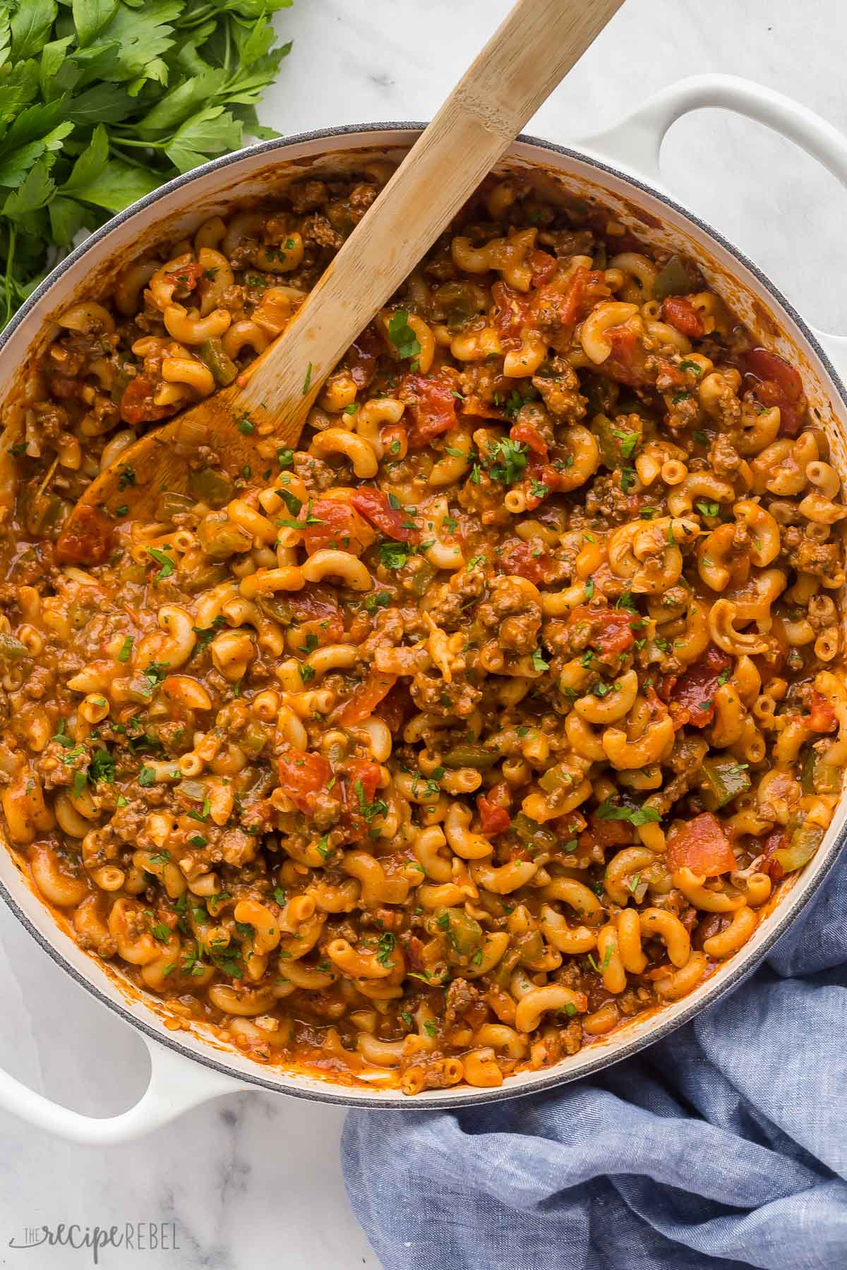 overhead image of goulash with wooden spoon stuck in