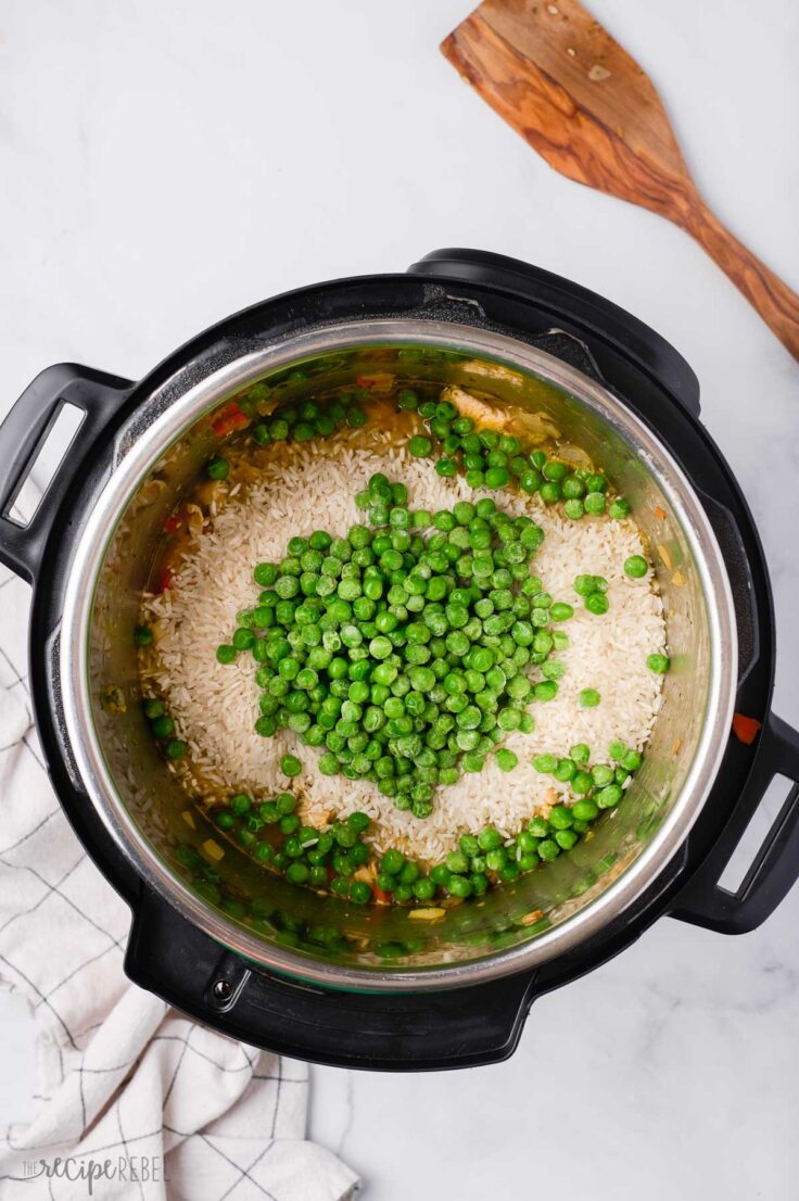 rice peas and liquid added to sauteed vegetables in instant pot