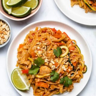 A plate of Instant Pot Pad Thai garnished with lime.