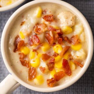 A mug full of chicken potato corn chowder.