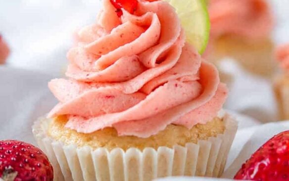 A strawberry lemonade cupcake with strawberry frosting.