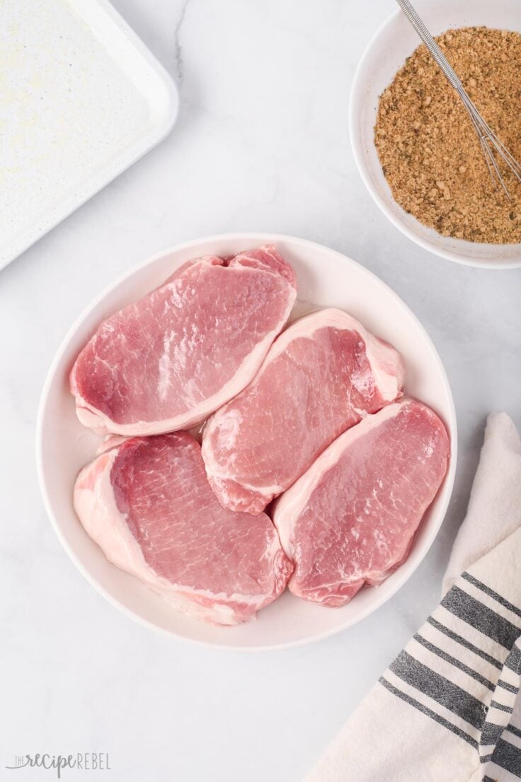 overhead image of uncooked pork chops unseasoned