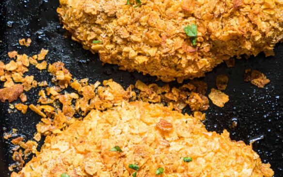 Baked ranch chicken on a baking sheet.