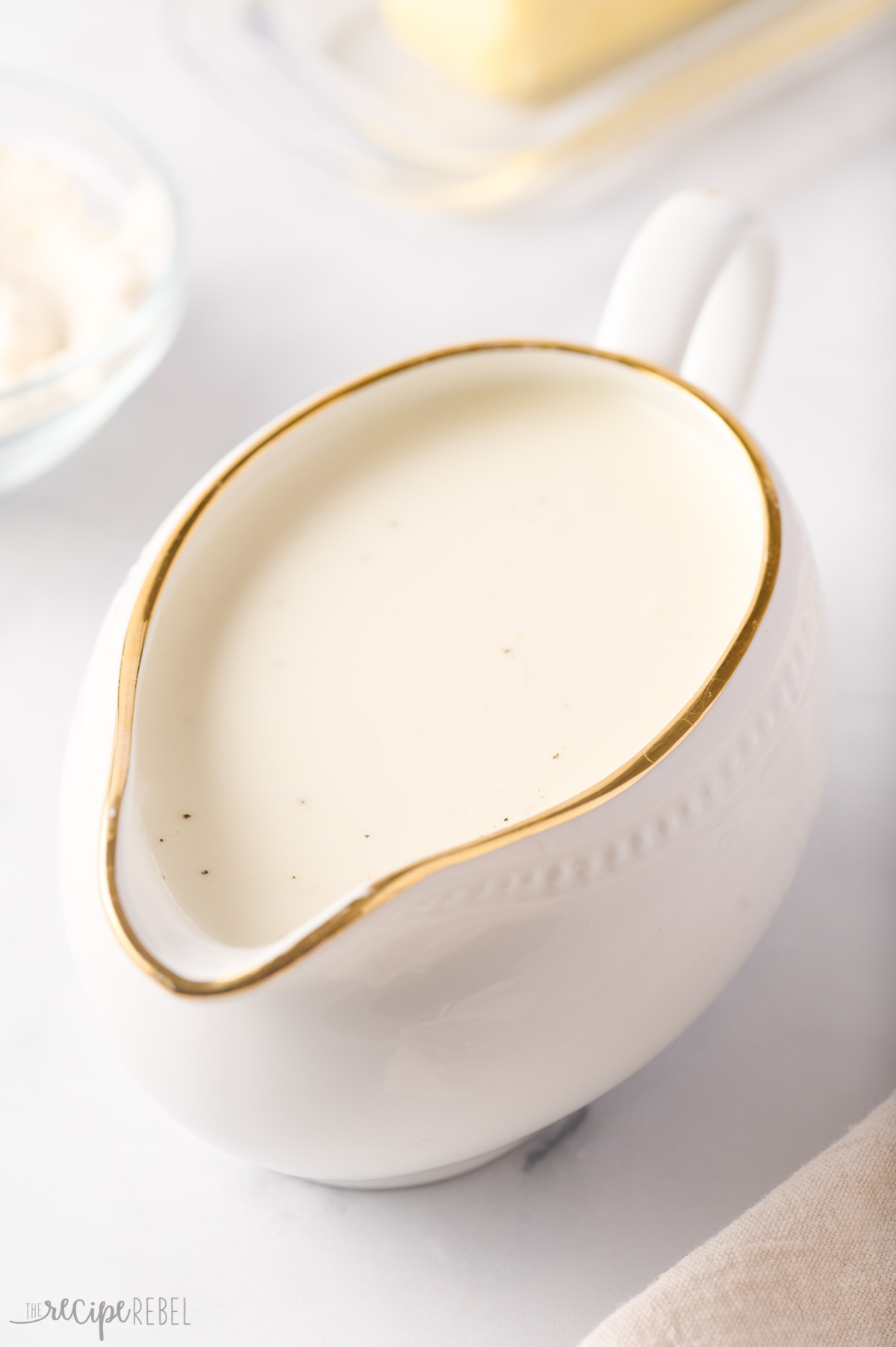 bechamel sauce in white gravy boat