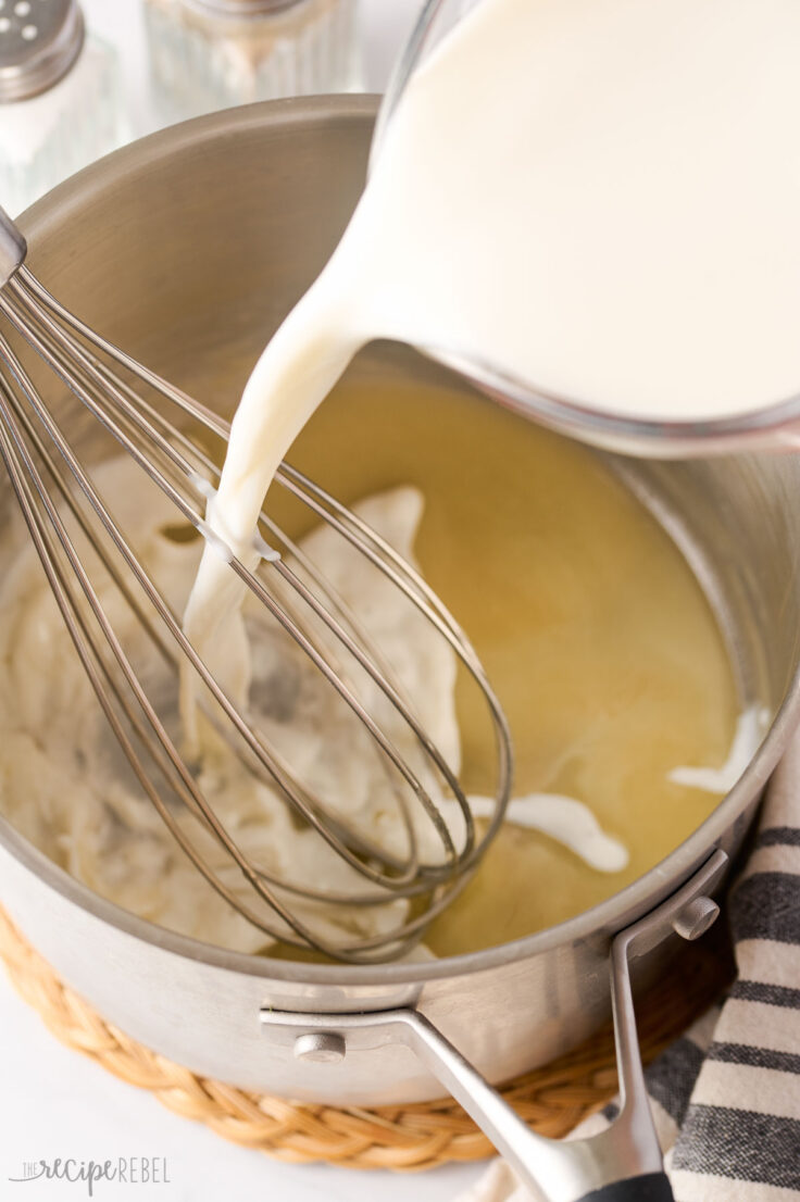 milk being added to roux in pot