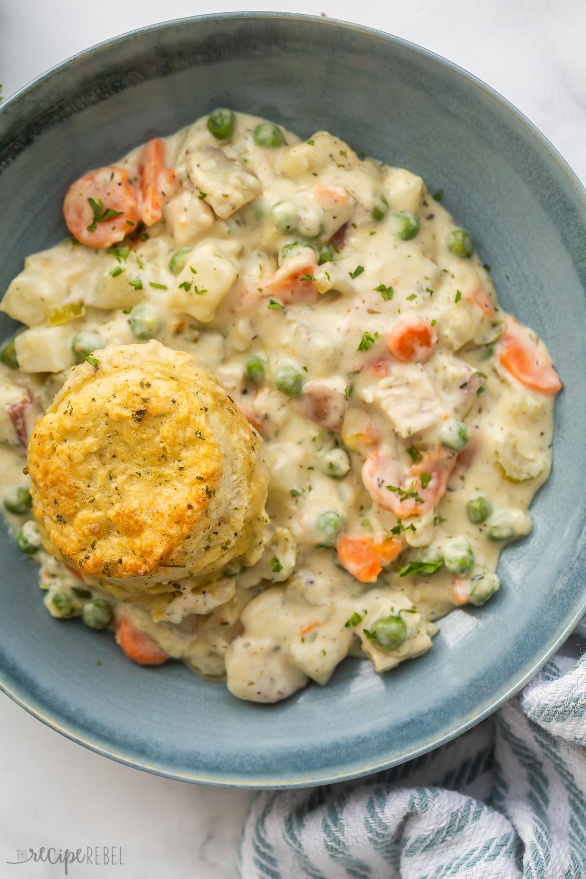 overhead image of chicken pot pie casserole in a blue bowl