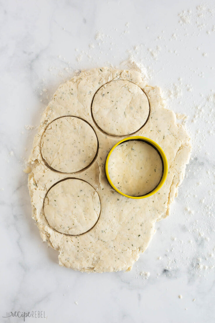 round biscuit cutter cutting out biscuits for pot pie casserole