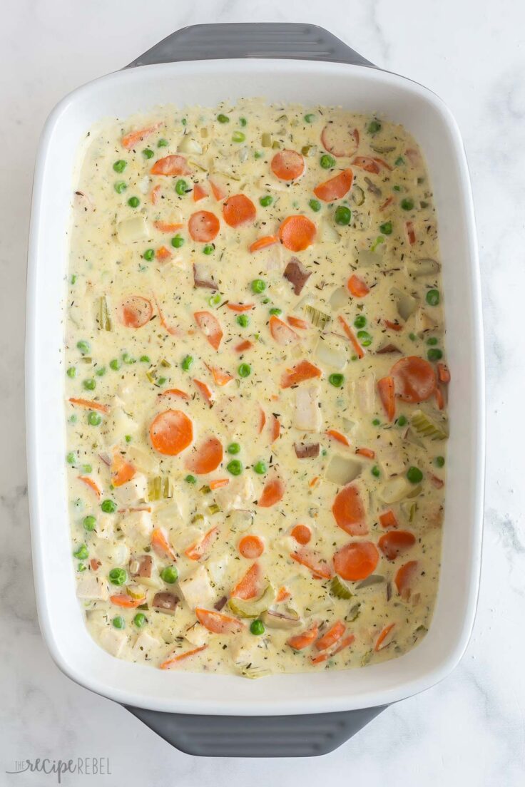 chicken pot pie casserole in white baking dish