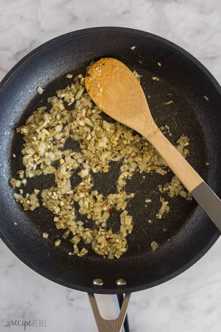 spices added to onions in skillet