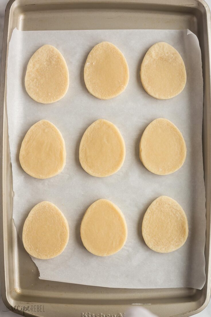 baked easter egg sugar cookies on a baking sheet