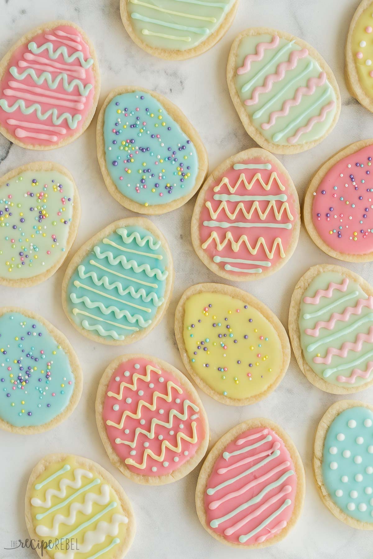 overhead image of easter egg sugar cookies in all colors