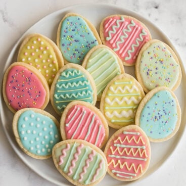 overhead image of plate of easter egg cookies in pastel colors