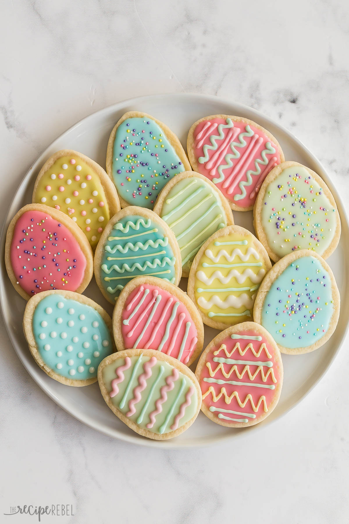 overhead image of plate of easter egg cookies in pastel colors