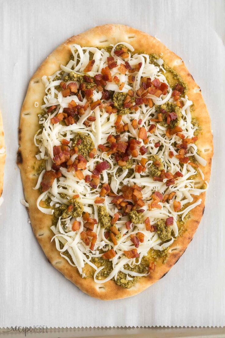 pesto bacon flatbread pizza before baking