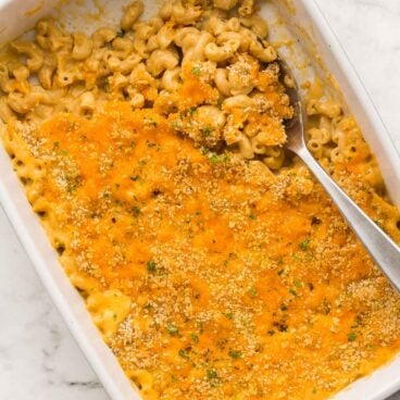 overhead image of baked mac and cheese with metal spoon stuck in