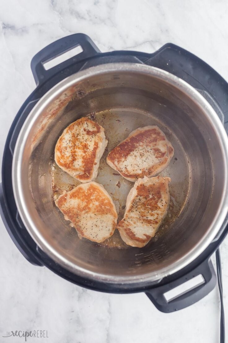 boneless pork chops browning in the instant pot