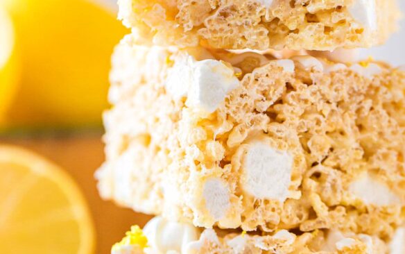 Three lemon rice krispie treats stacked on top of one another.