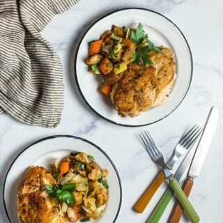 Chicken an vegetables served on plates.