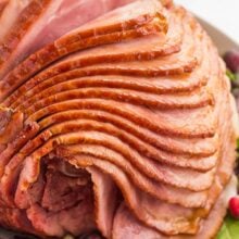 close up image of spiral ham on white platter