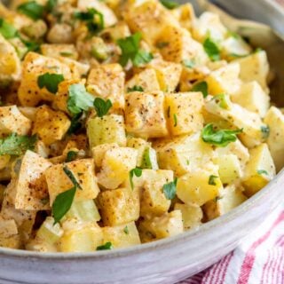 A large bowl of Cajun potato salad.