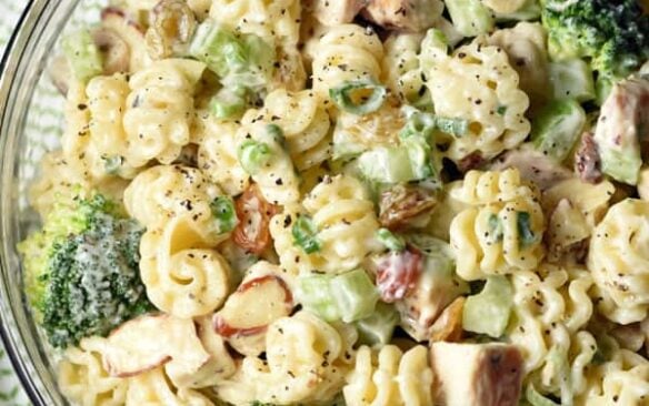Top view of a bowl of chicken and broccoli pasta salad.
