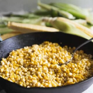 A skillet full of fried corn.