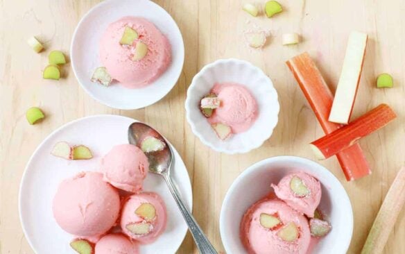 Top view of assorted bowls with scoops of pink rhubarb gelato.