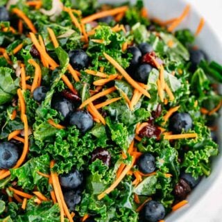 A large bowl of kale blueberry salad.