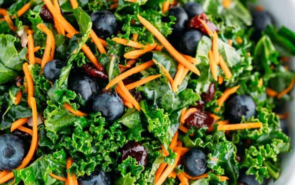 A large bowl of kale blueberry salad.