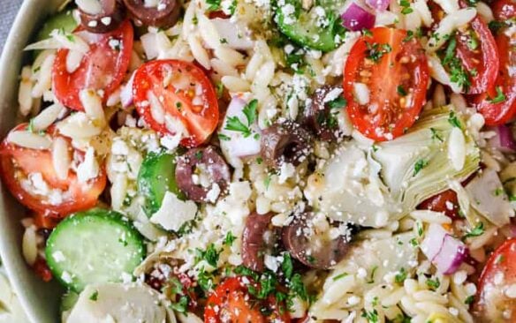 Top view of a bowl of Mediterranean orzo salad.