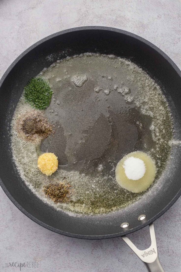 butter and spices in a black skillet.