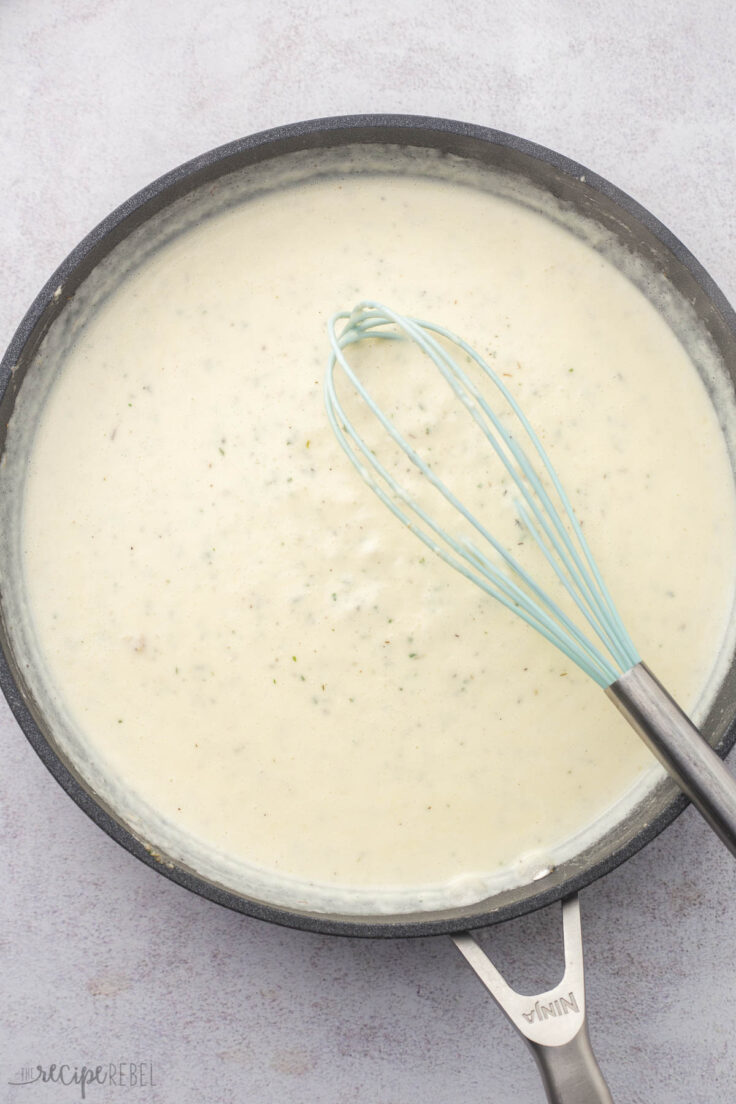 milk added to roux in skillet to make scalloped potato sauce.