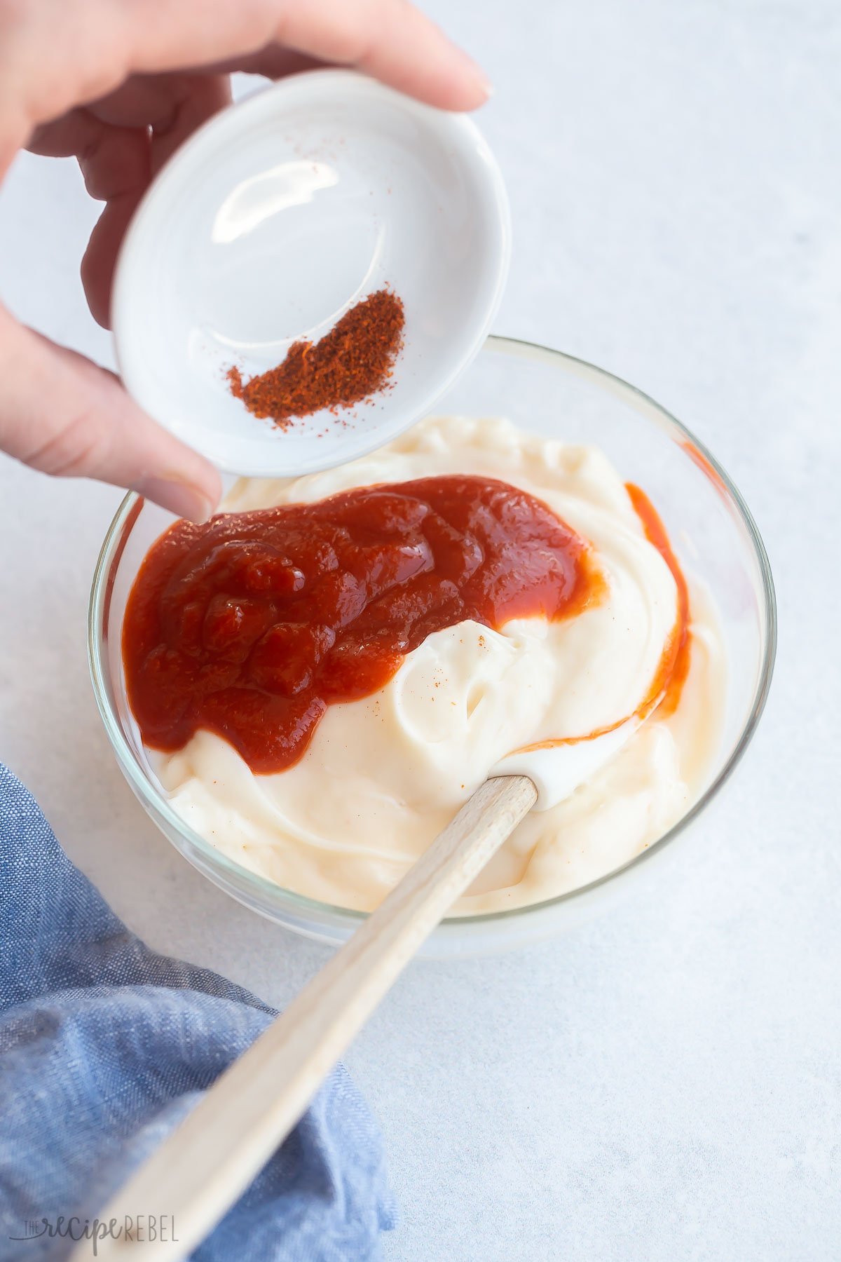 chili powder being added to mayo