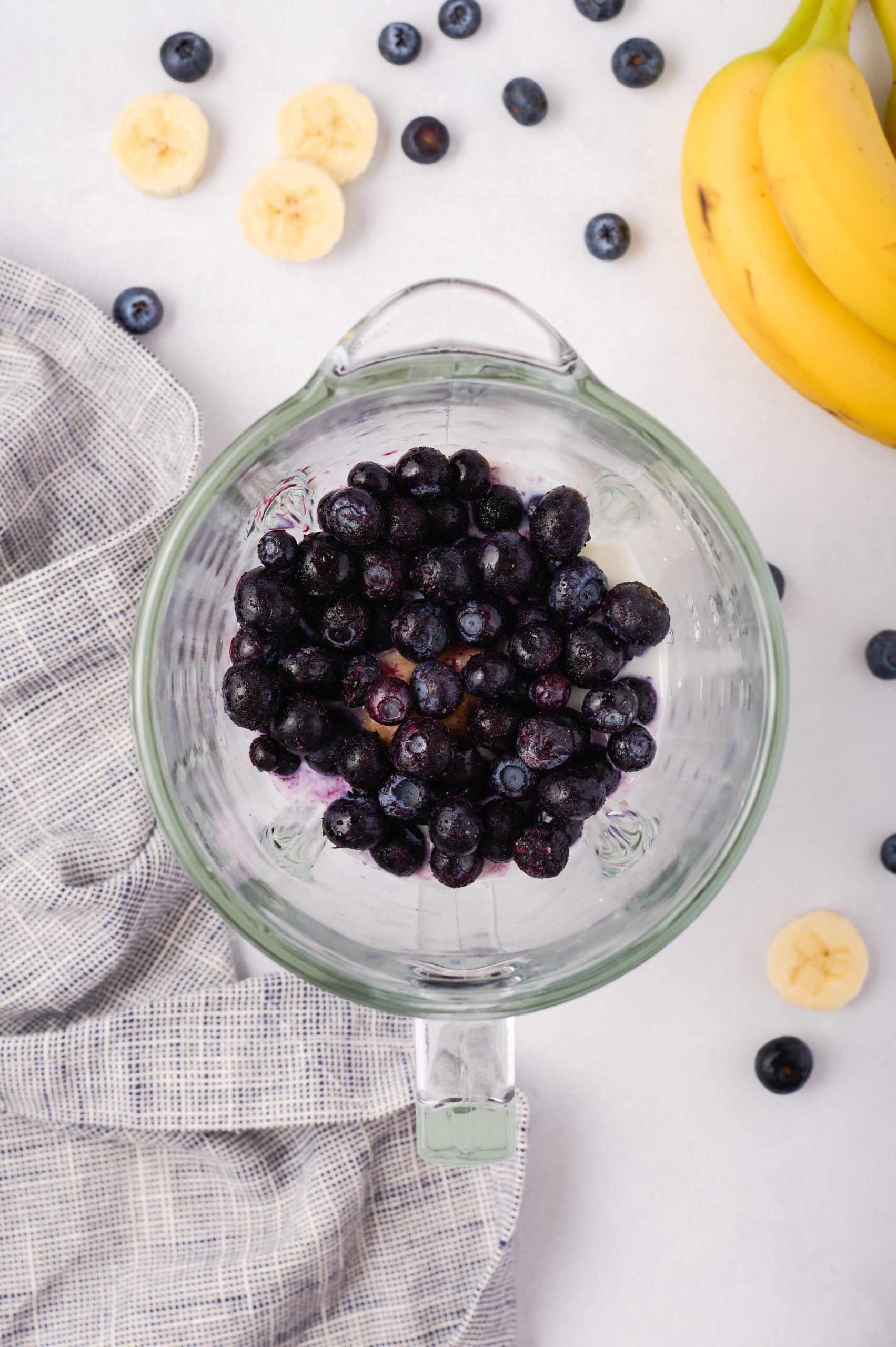 frozen blueberries added to blender.