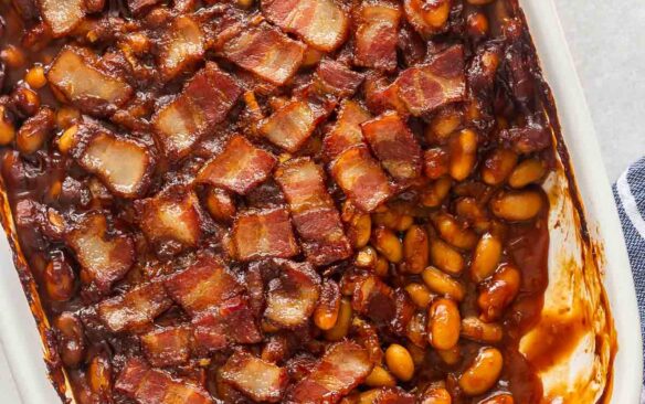 overhead image of baked beans in white baking dish.