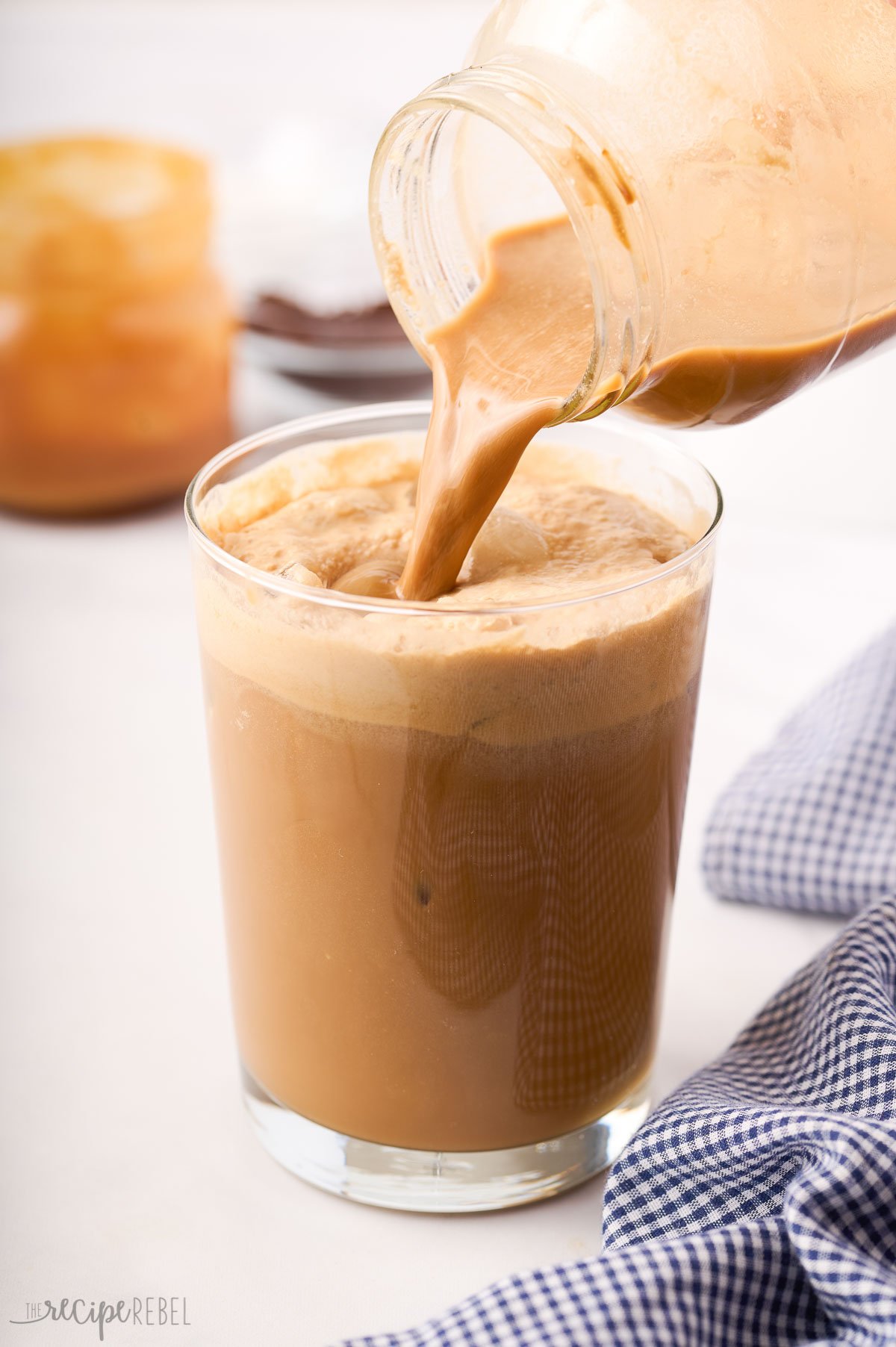 jar of frappe being poured into glass.