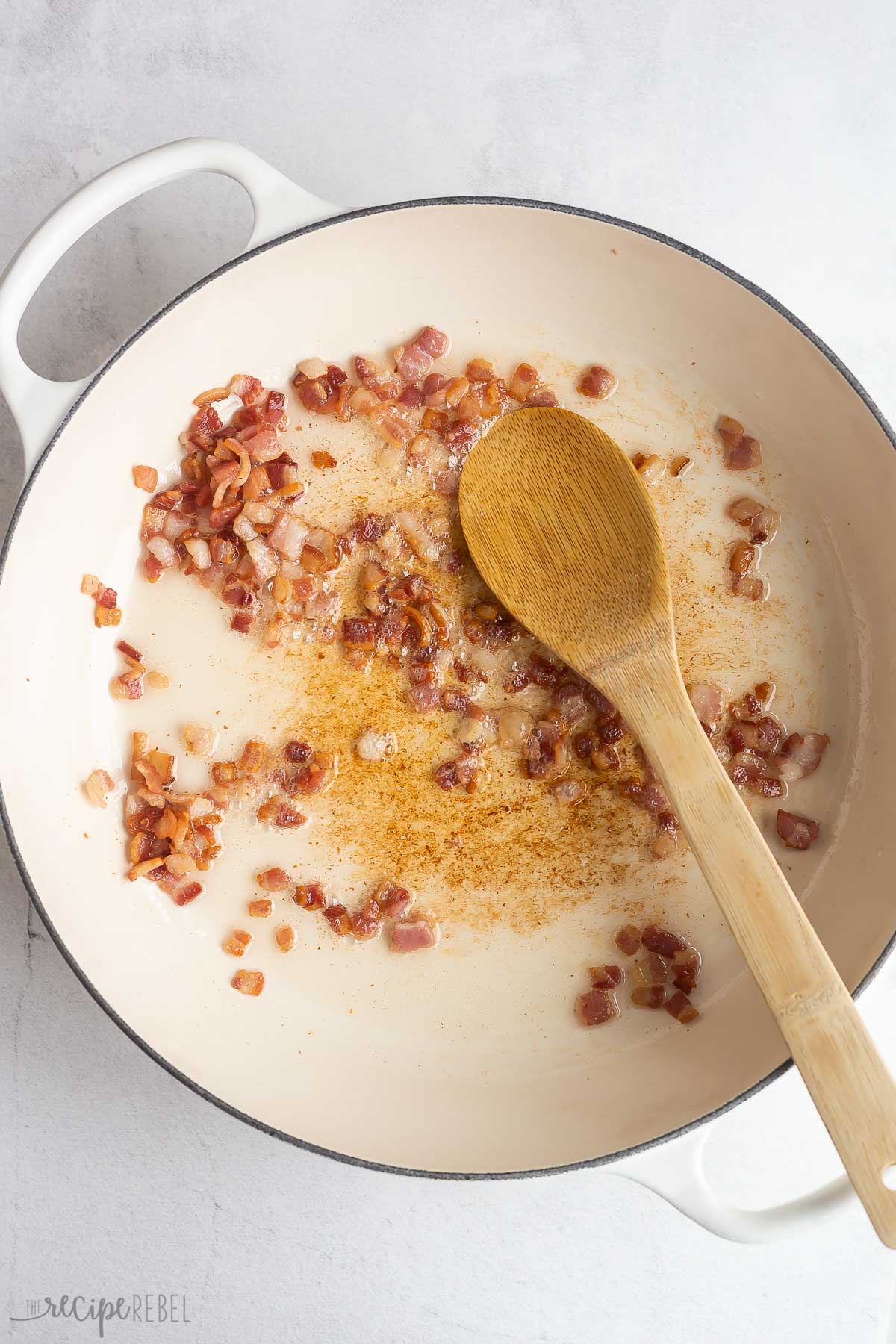 crispy bacon cooked in white skillet