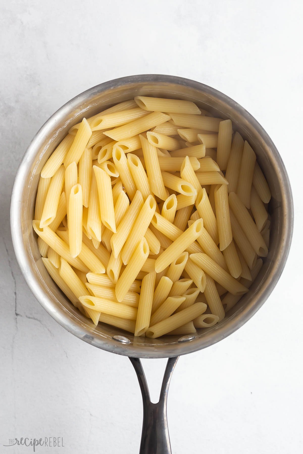 cooked penned pasta in a stainless steel pot