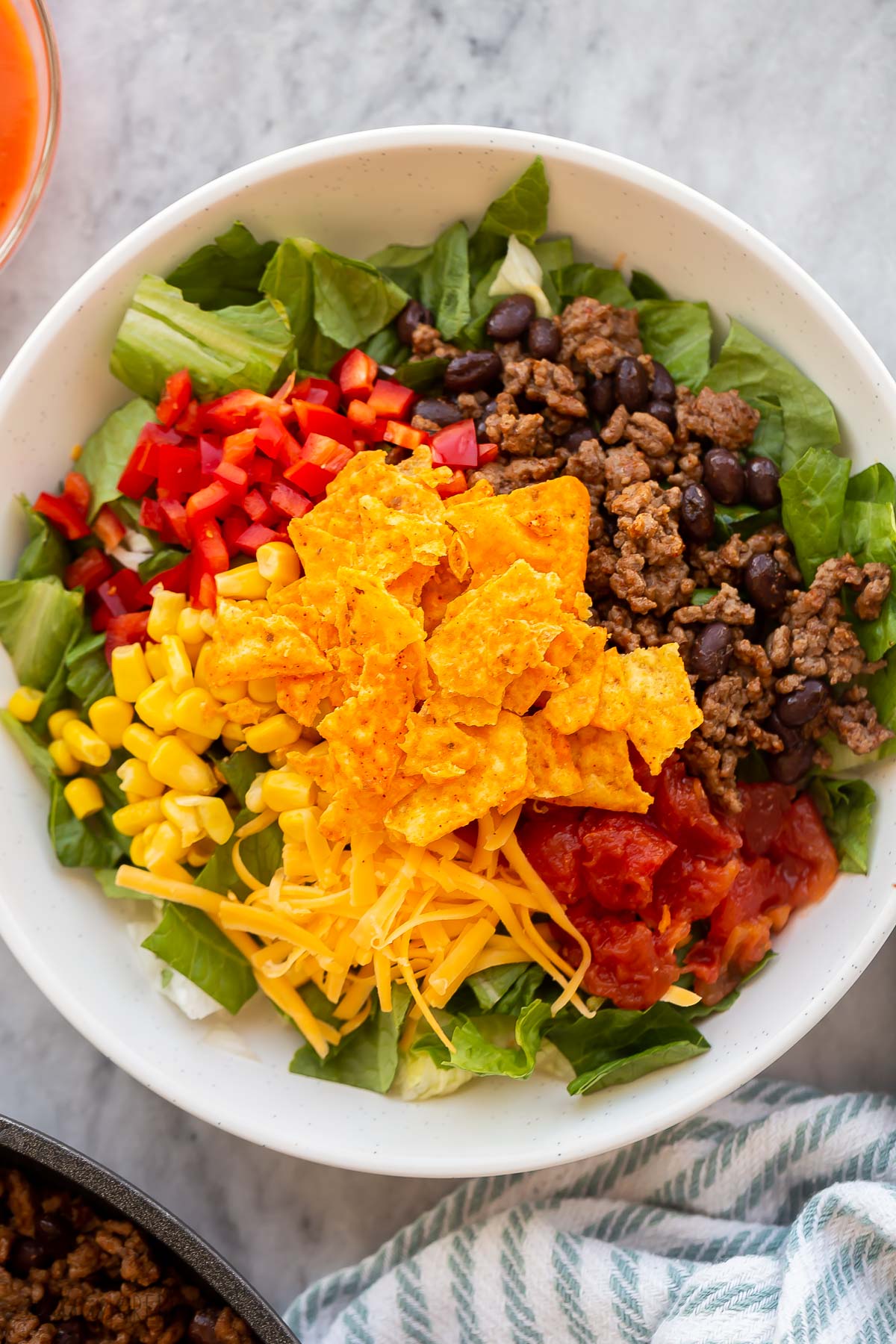 all ingredients needed for taco salad ready to mix