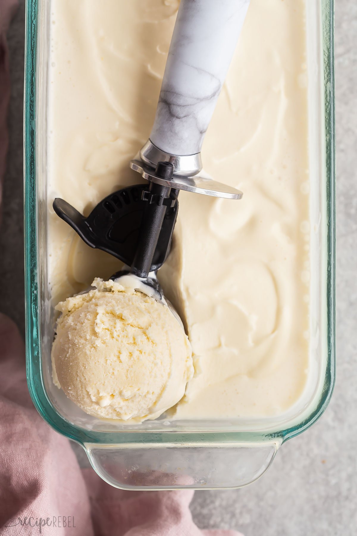 single scoop of ice cream in ice cream scoop.
