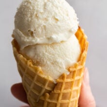 two scoops of homemade ice cream in a cone.