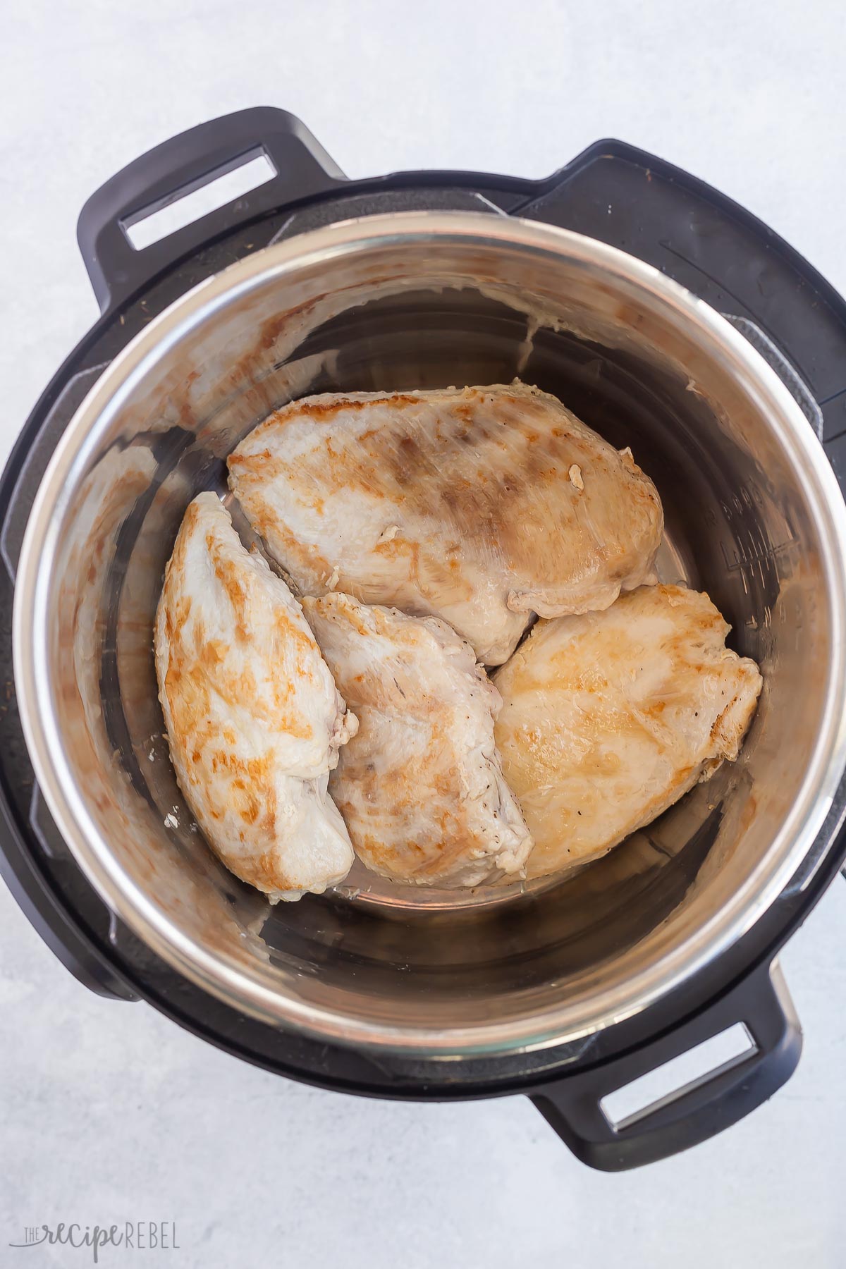 seared chicken on trivet in instant pot