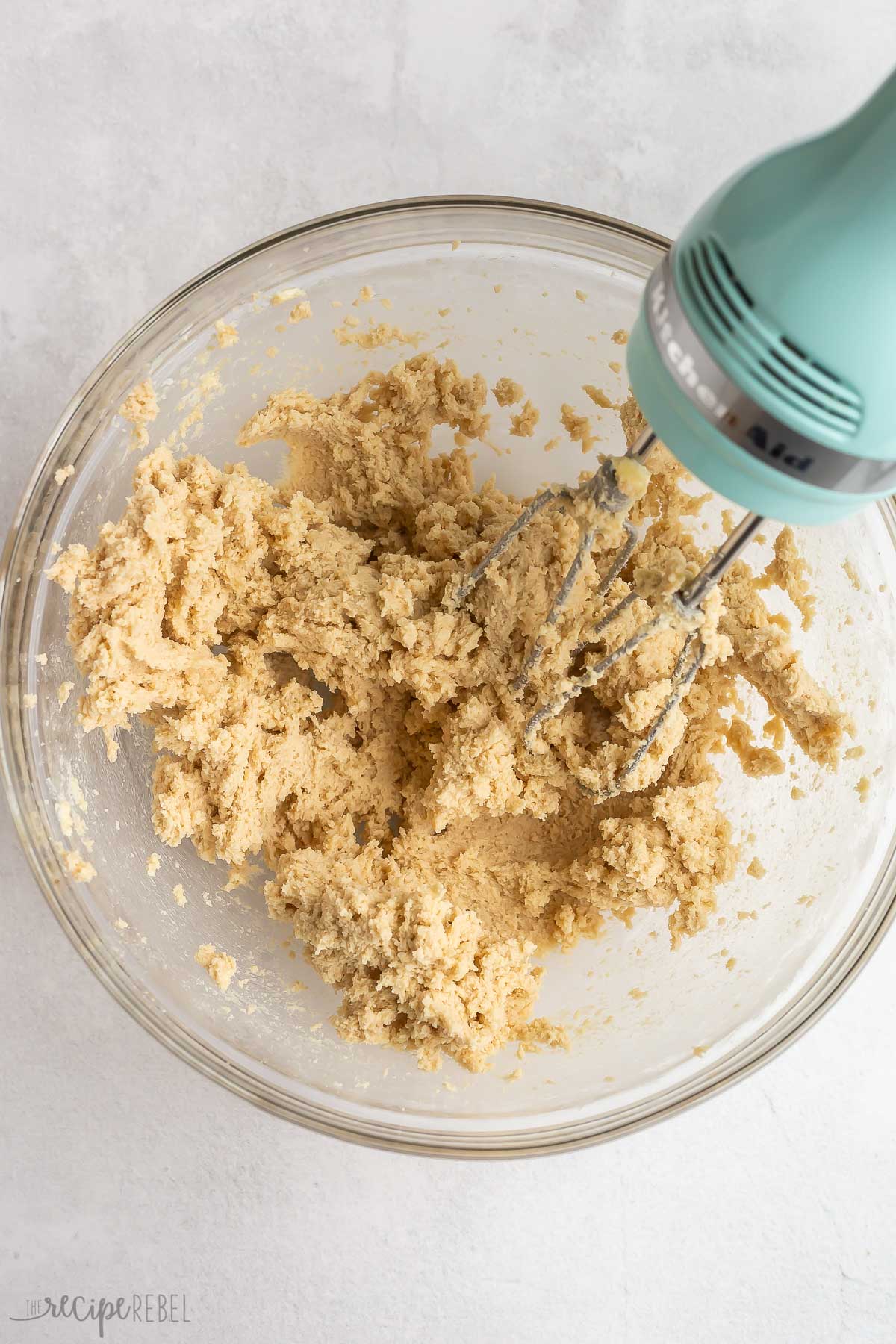 butter and sugar creamed together in glass bowl with electric mixer.