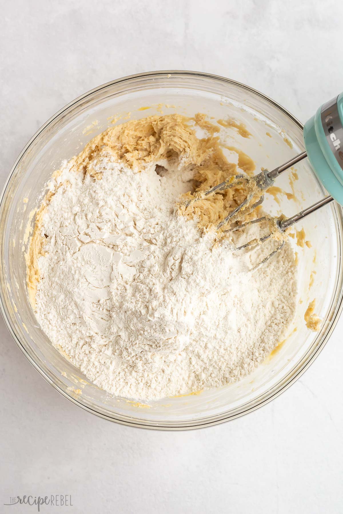 flour added to wet ingredients to make cookie dough.