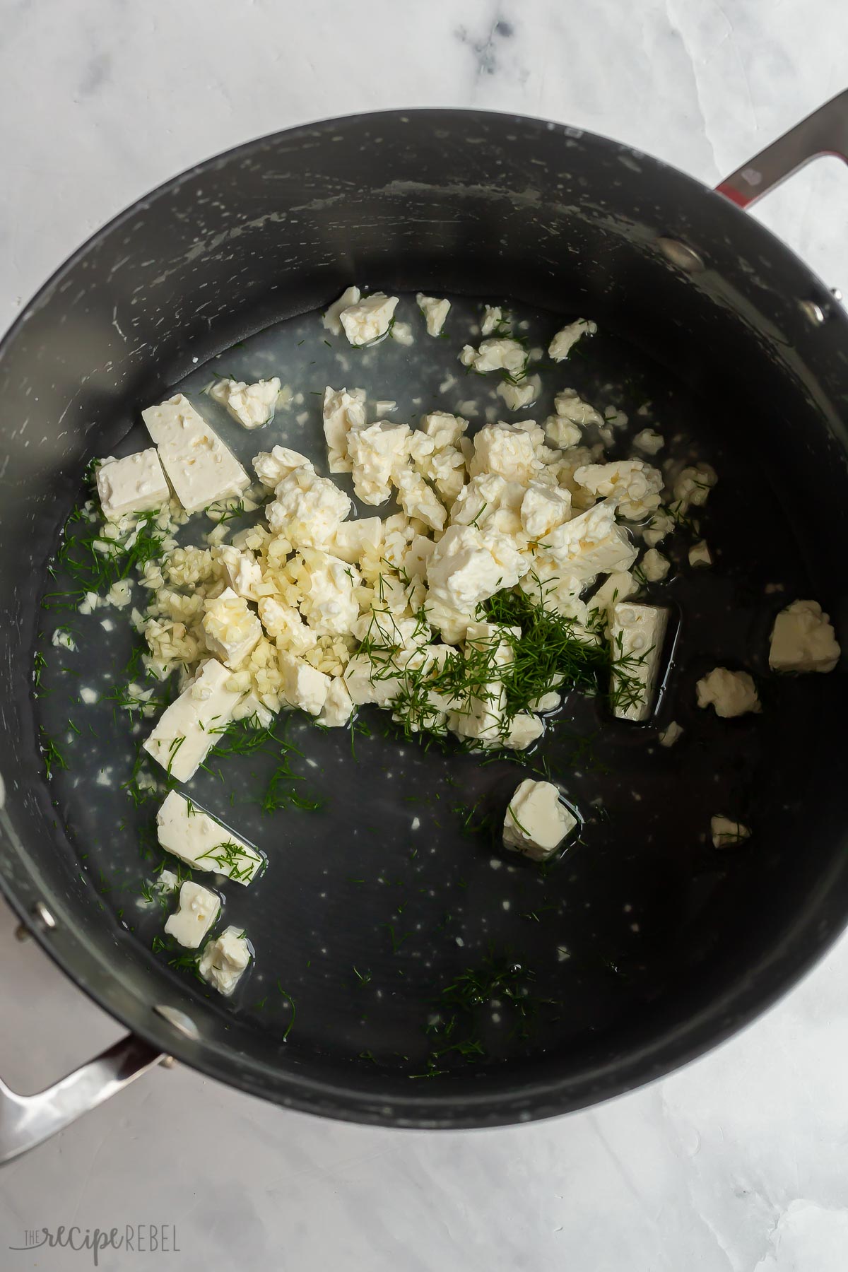 chopped feta with fresh dill and pasta water in large pot.