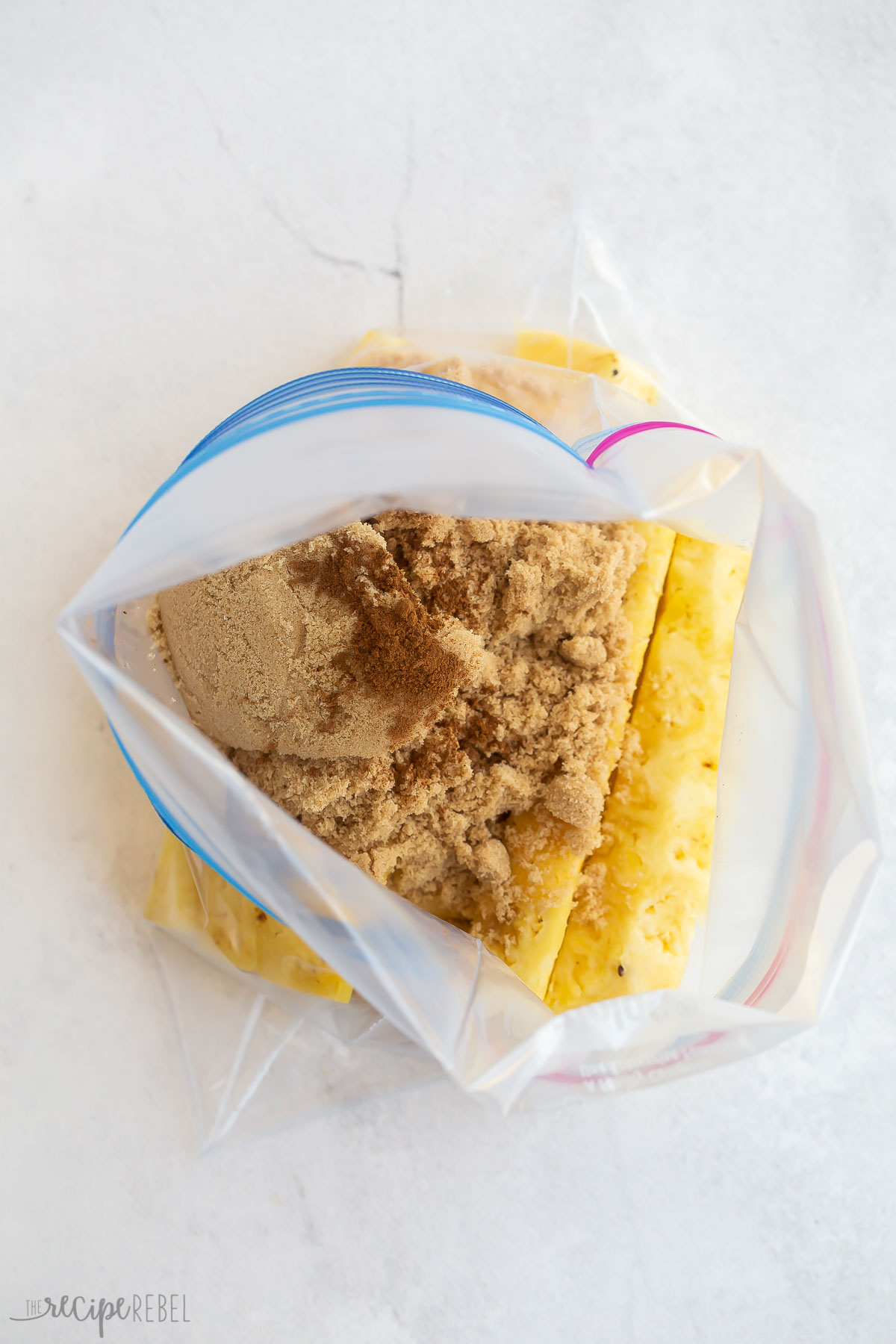 pineapple spears brown sugar and cinnamon in a large ziploc bag.