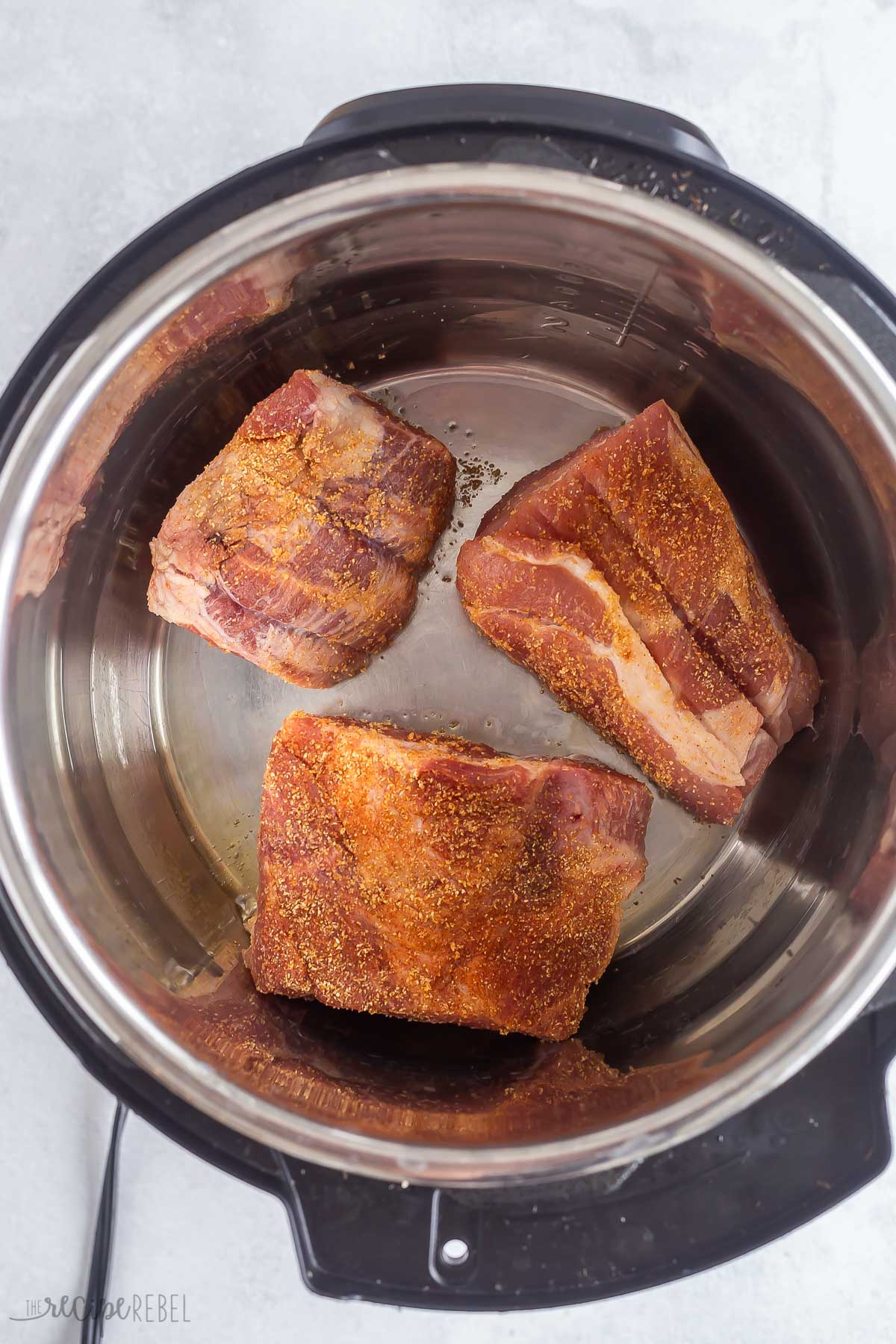 chunks of pork shoulder in instant pot to sear.