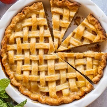 overhead image of whole peach pie with lattice crust.