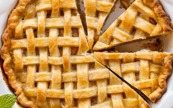 overhead image of whole peach pie with lattice crust.